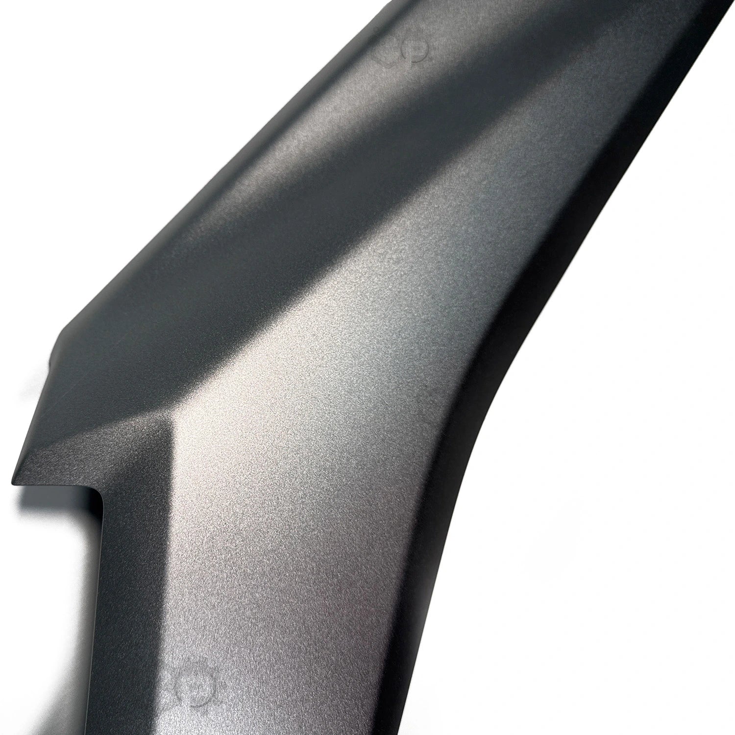Close-up of a motorbike silver 
fender on a white background
