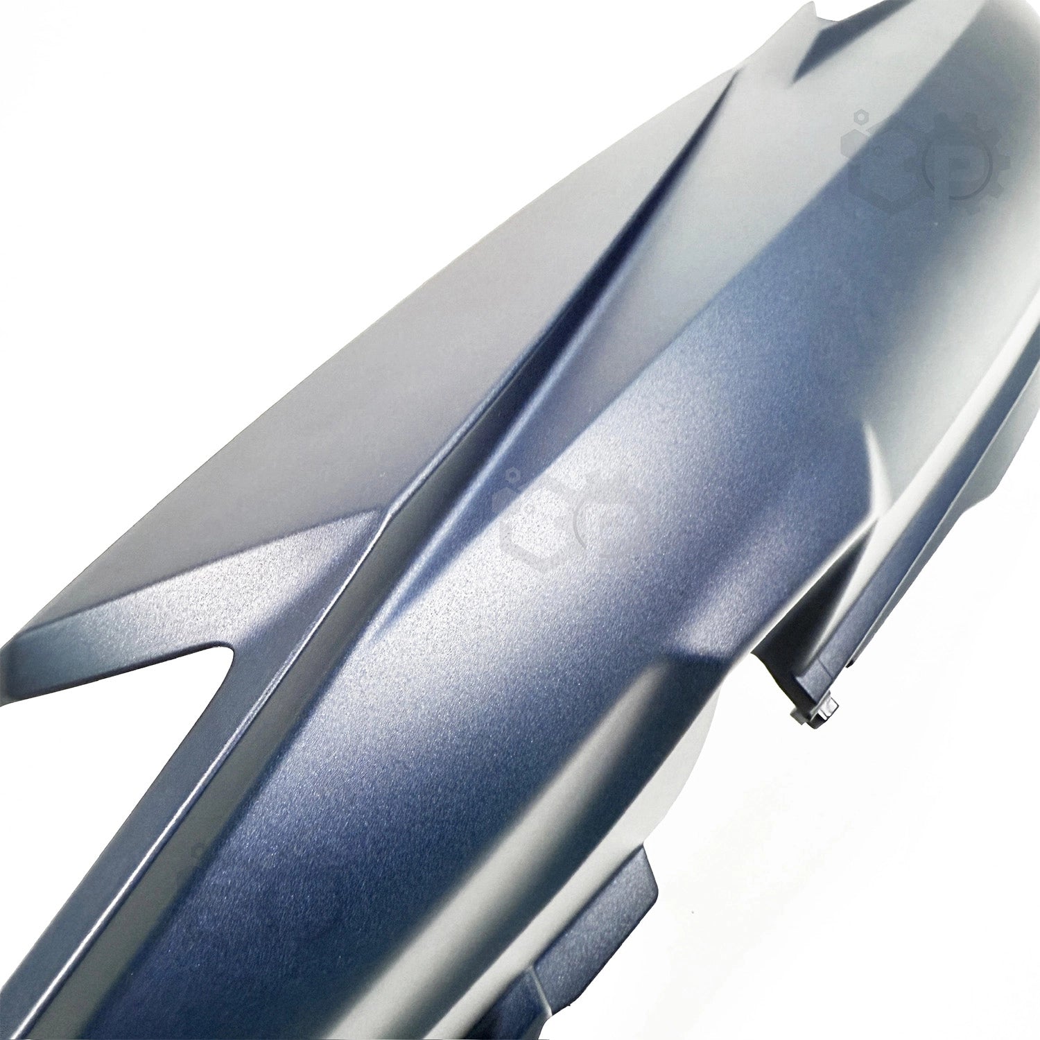Close-up of a metallic blue car fender on a white background
