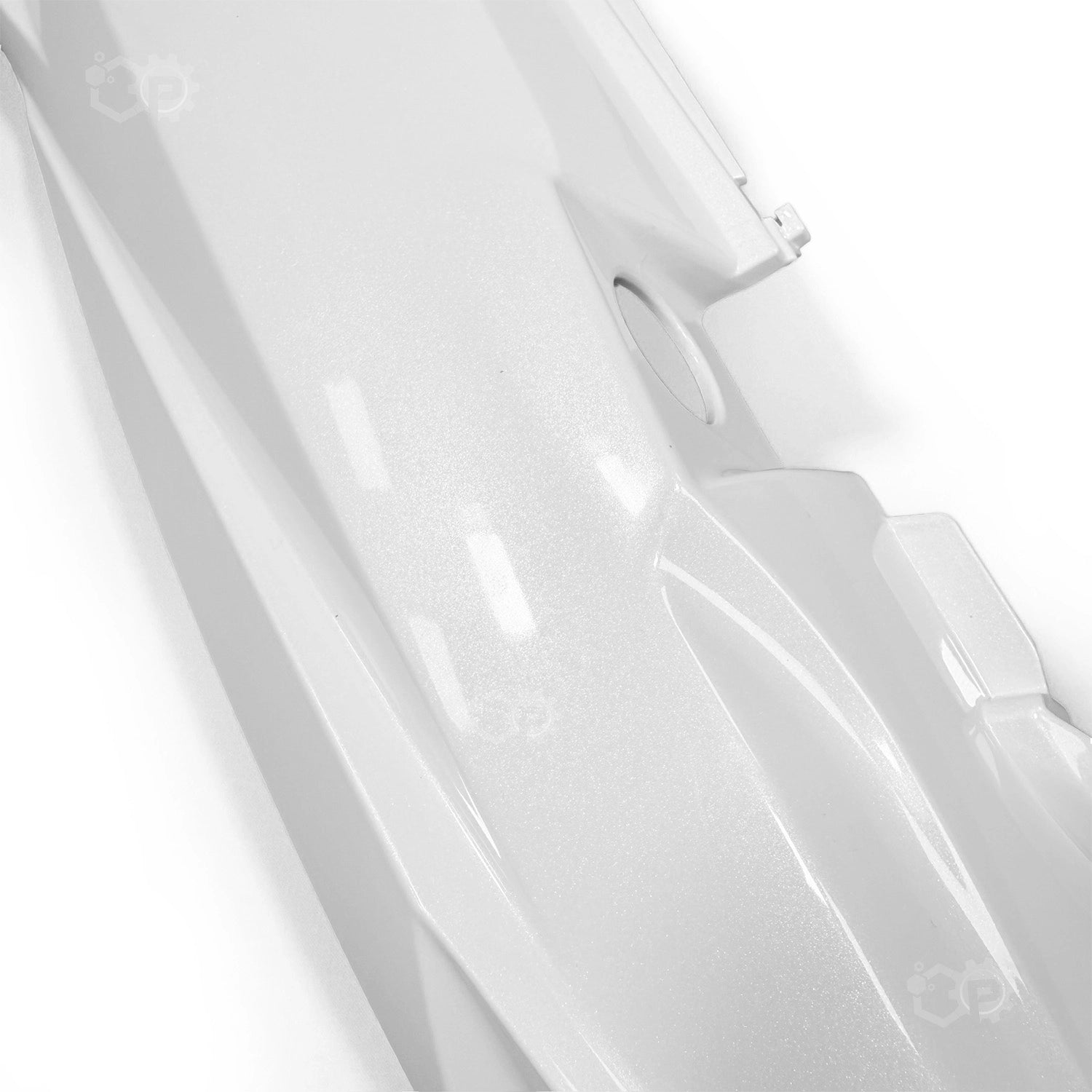 Close-up of a white plastic component with a glossy finish on a light gray background