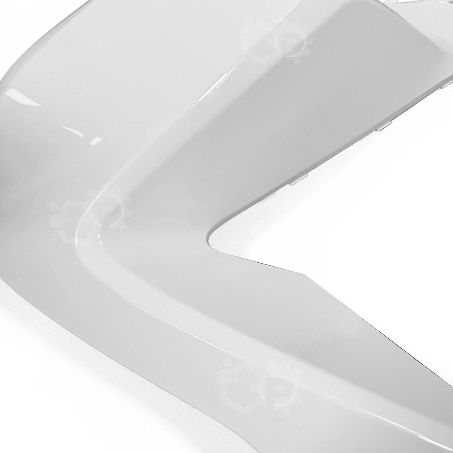 Close-up of a white ceramic plate with a glossy finish on a white background