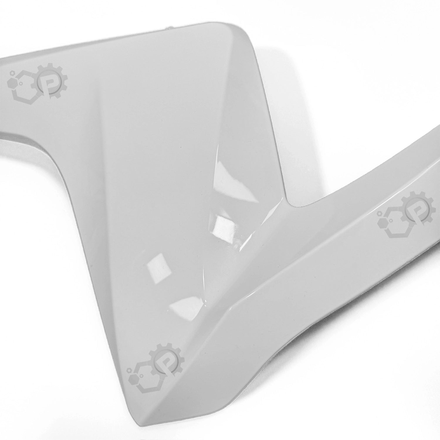 White plastic bracket with cut-out design on a white background