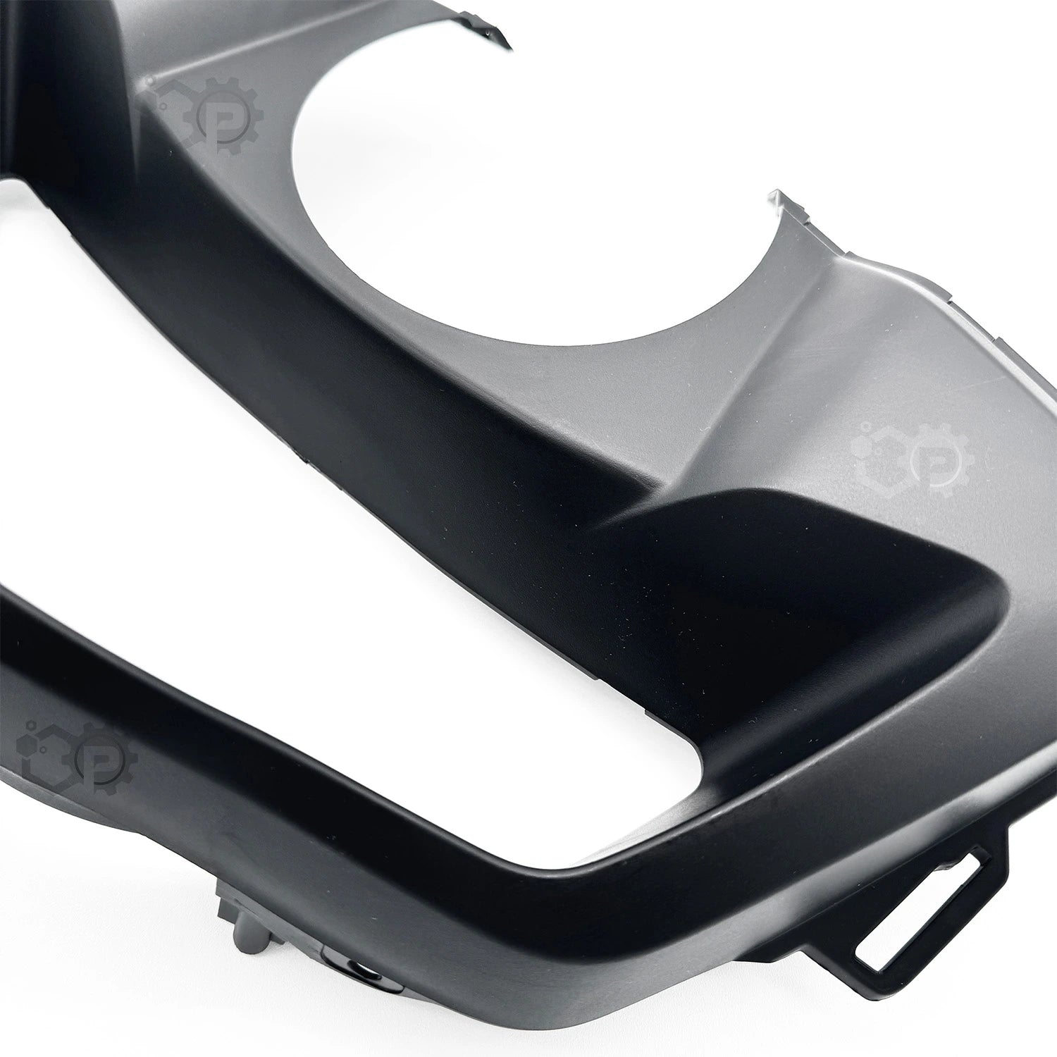 Close-up of a black plastic car bumper cover on a white background