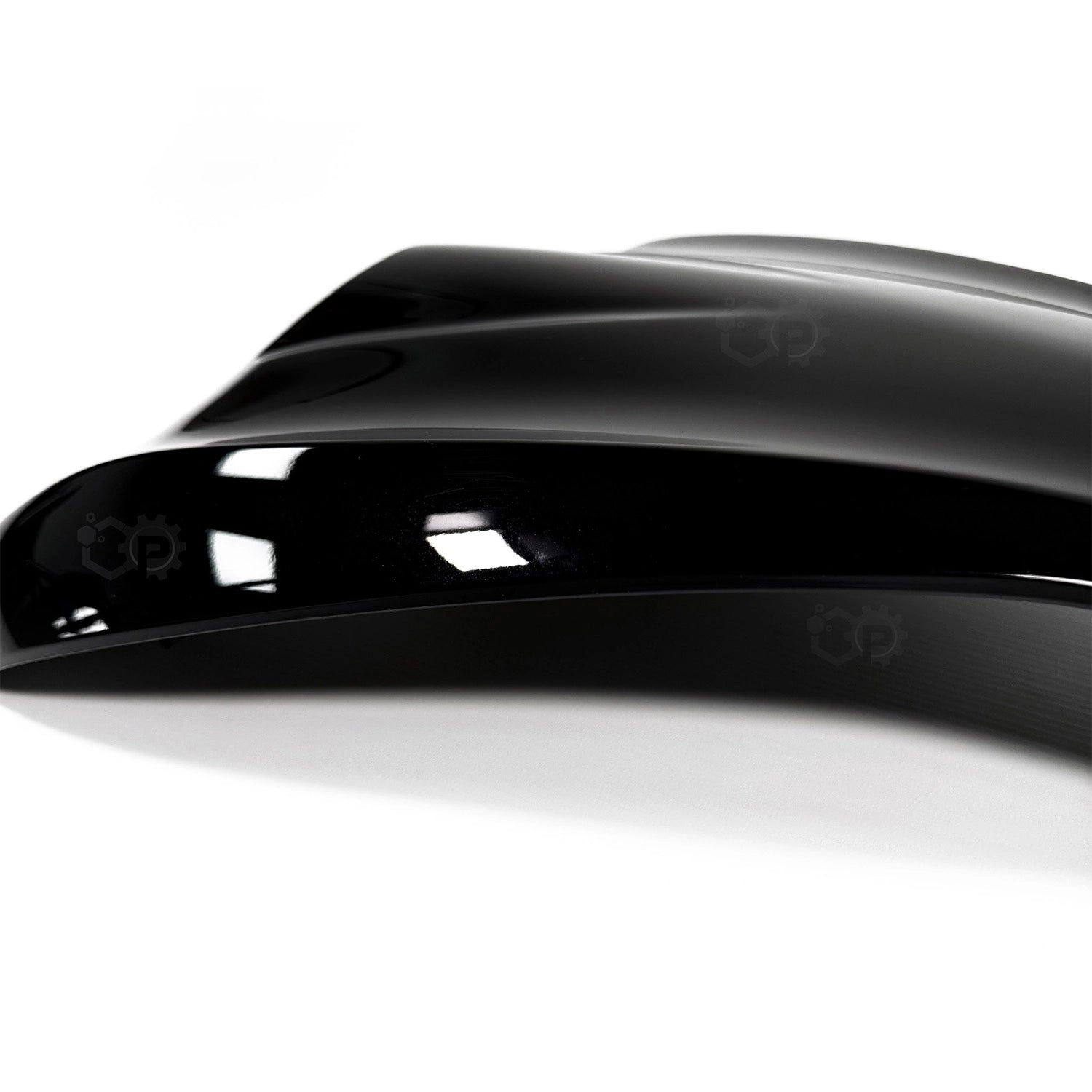 Close-up of a glossy black product on a white background