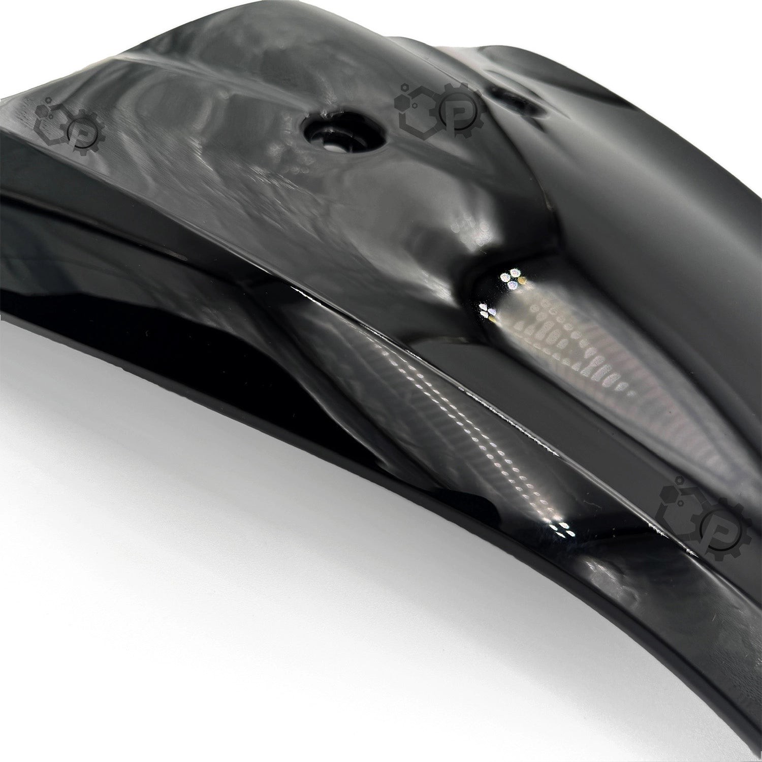 Close-up of a car's black rear spoiler with visible branding on a white background