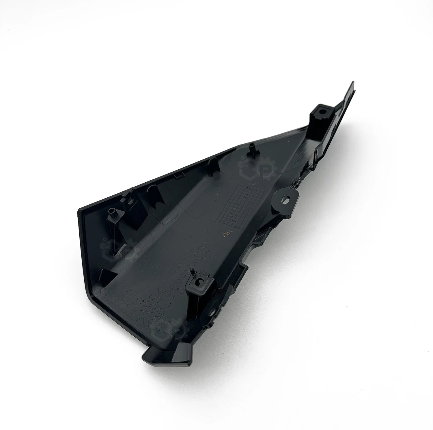 Black plastic component on a white background