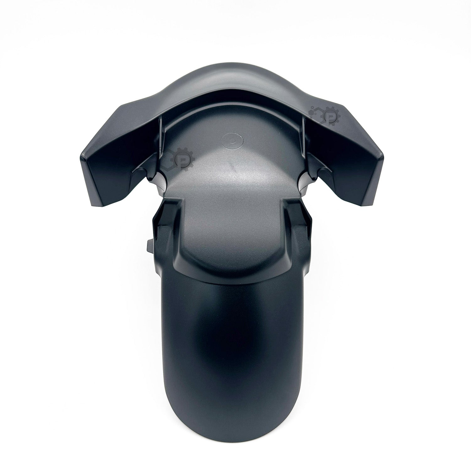 Black plastic component on a white background