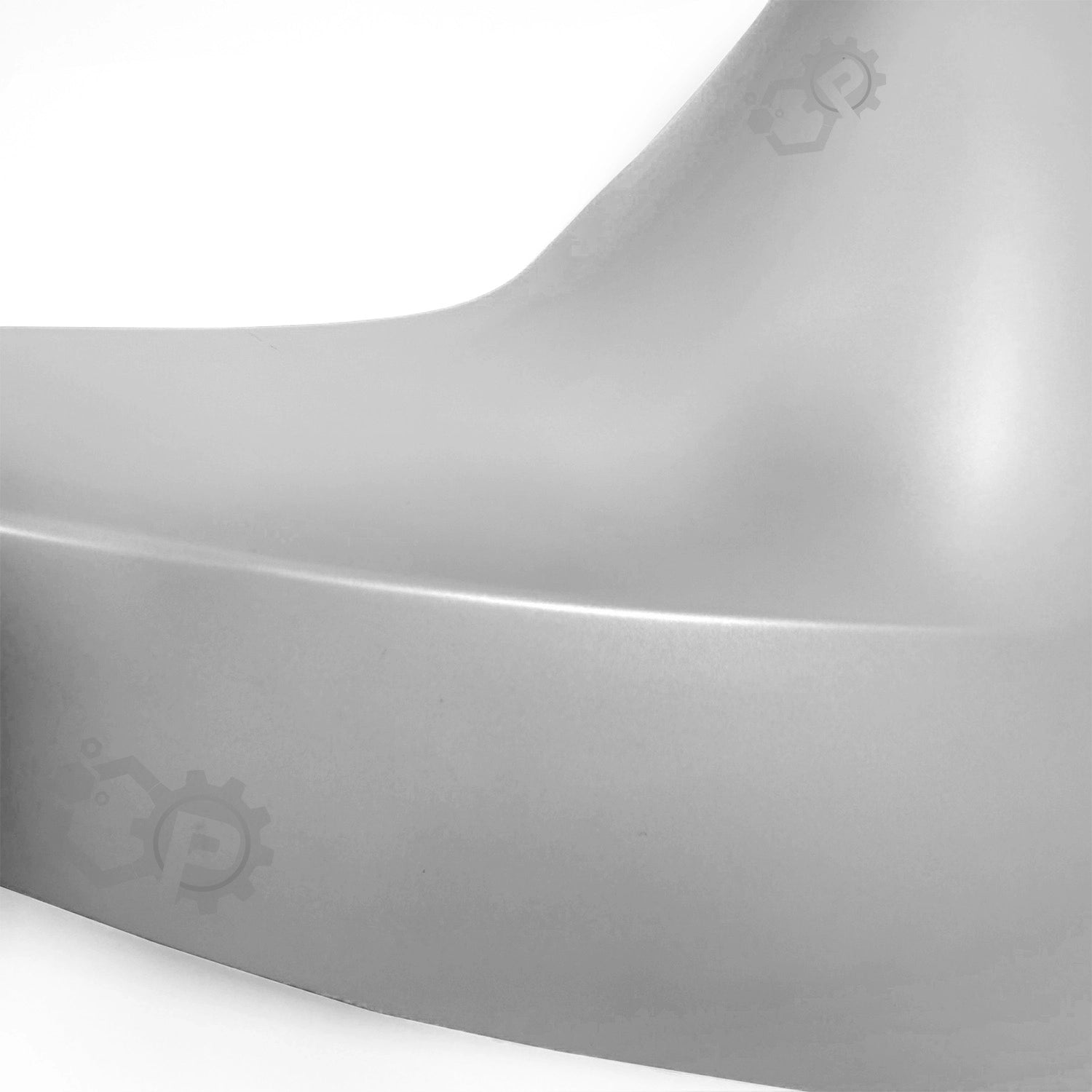 Close-up of a car fender with a brand logo on a white background