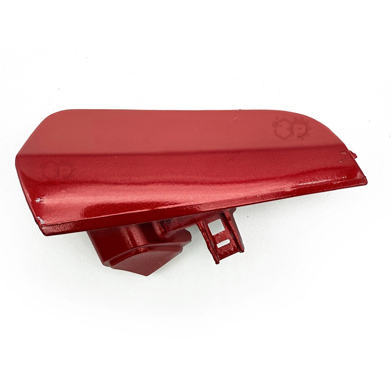 Red plastic component on a white background
