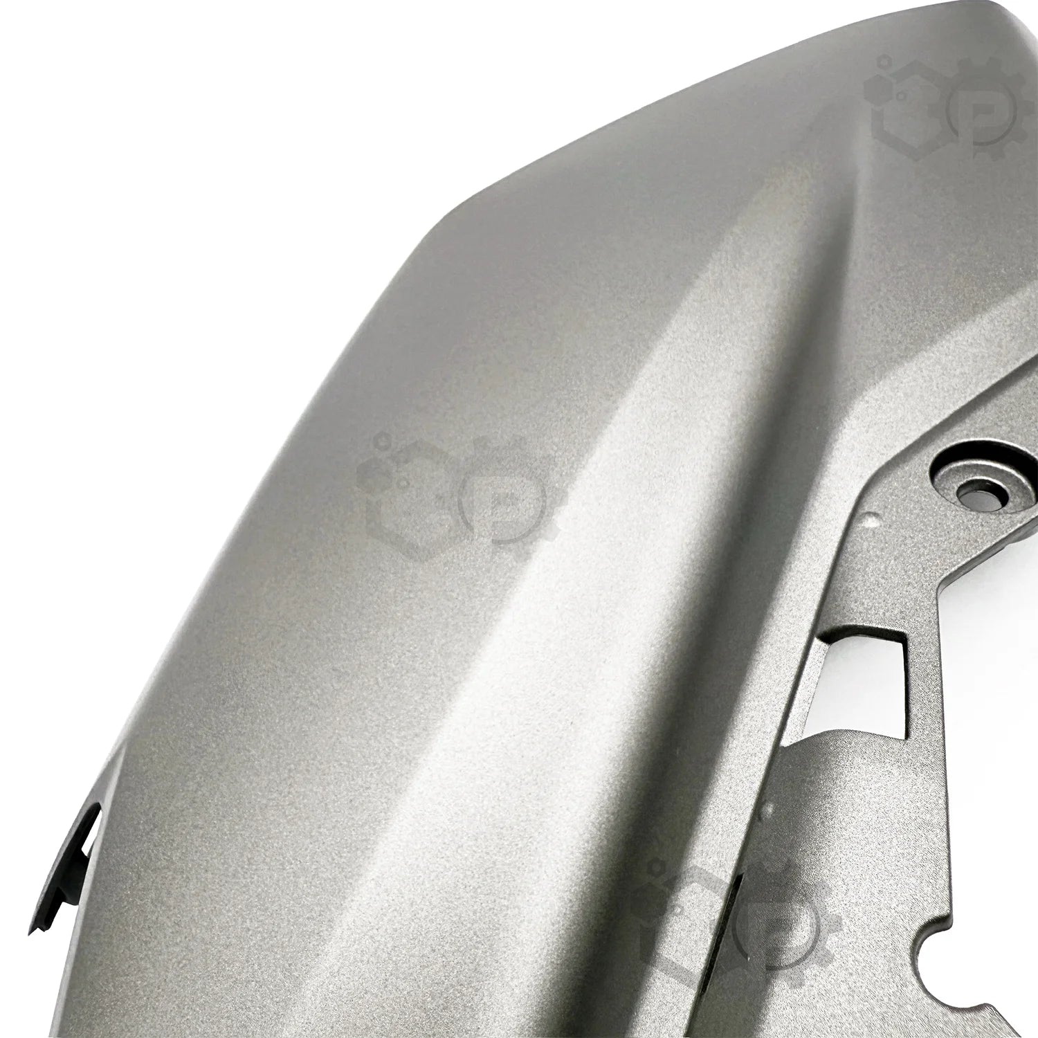 Close-up of a metallic object with a brand logo on a white background