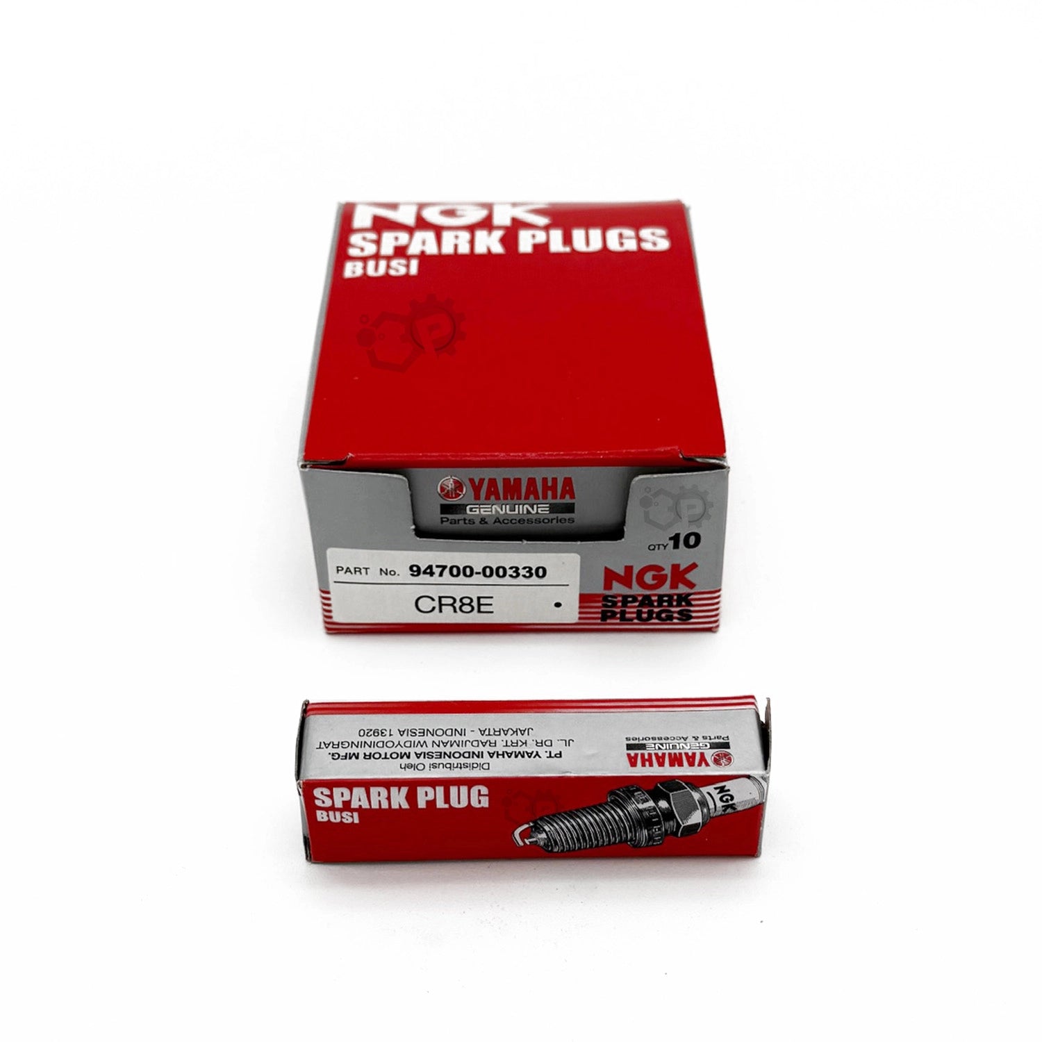 Box of NGK spark plugs with a white background
