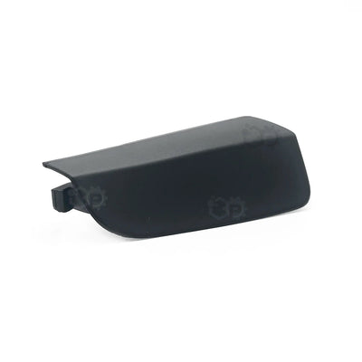 Black plastic component on a white background