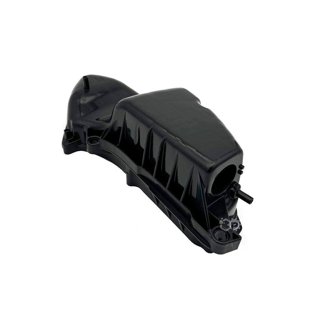 Black plastic automotive part on a white background