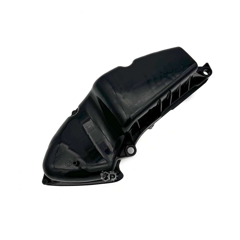 Black plastic automotive part on a white background