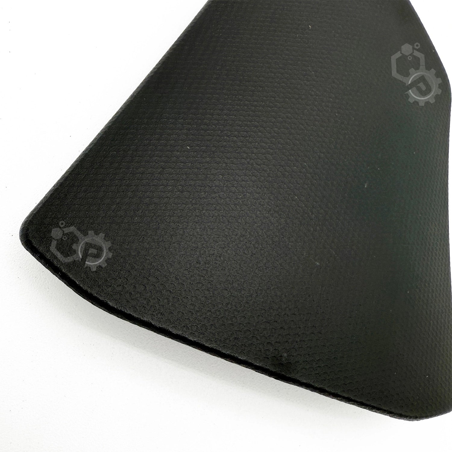 Black textured object with a brand logo on a white background