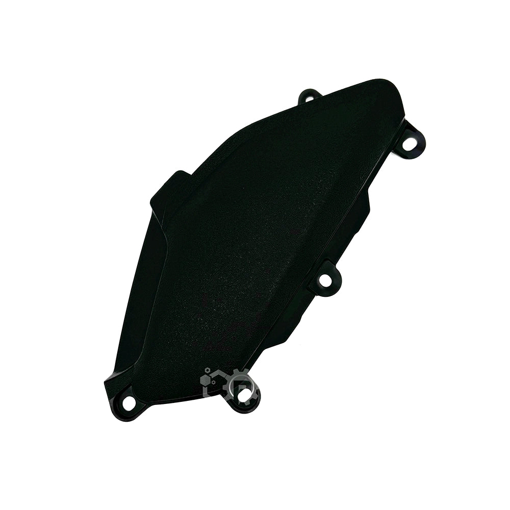 Black plastic component on a white background