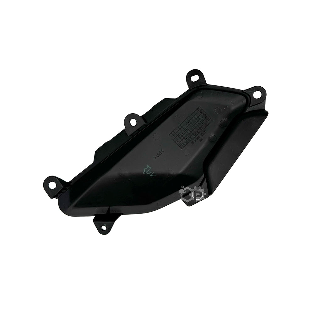 Black plastic automotive part on a white background